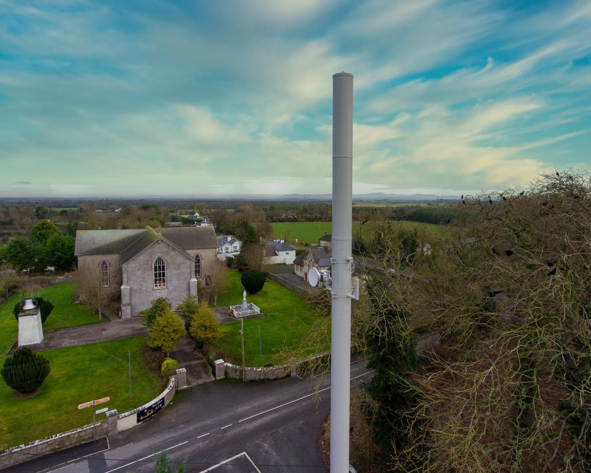 Alpha Wireless' AW3871 Tri-Sector antenna on streetworks pole at Vicarstown, Co. Laois, Ireland - rural heritage, planning sensitive area.
